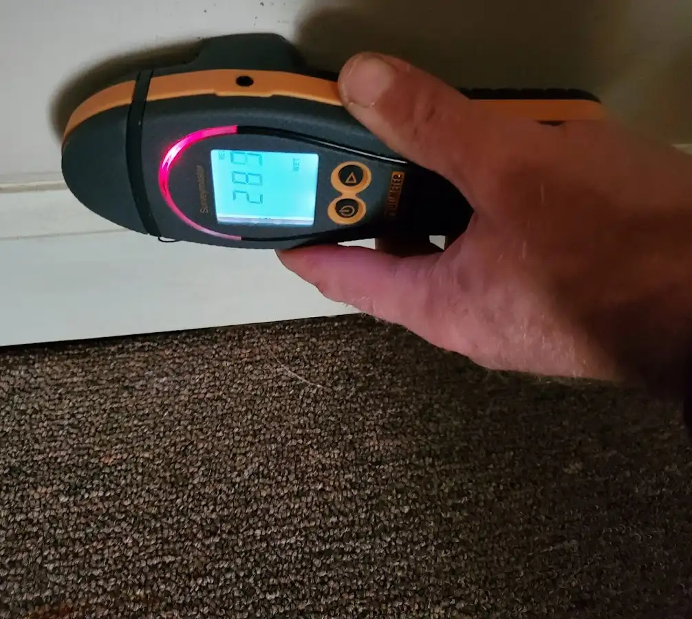 Moisture detection at baseboard during Burst Pipe Cleanup in Durham